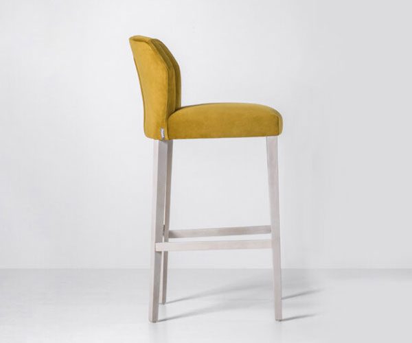 A yellow and white bar stool