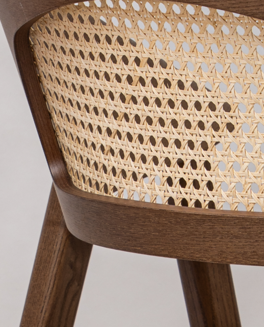 Detailed view of the Dina Arm USW dining chair highlighting woven wicker craftsmanship, premium wood construction, and hospitality-grade design.