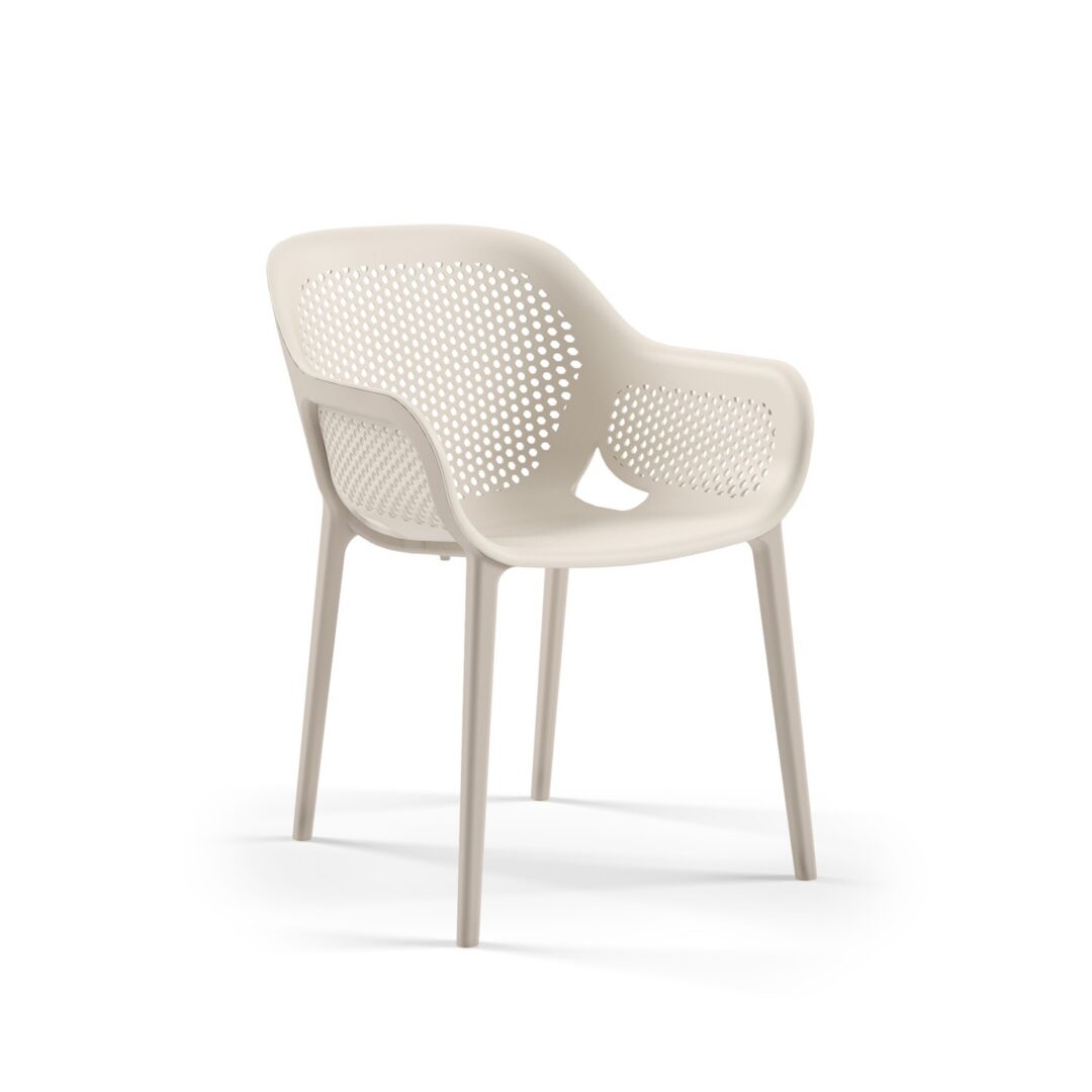 Atra armchairs in a warm hotel lobby seating area, in-stock lounge furniture ready to ship from Keca's Florida showroom.