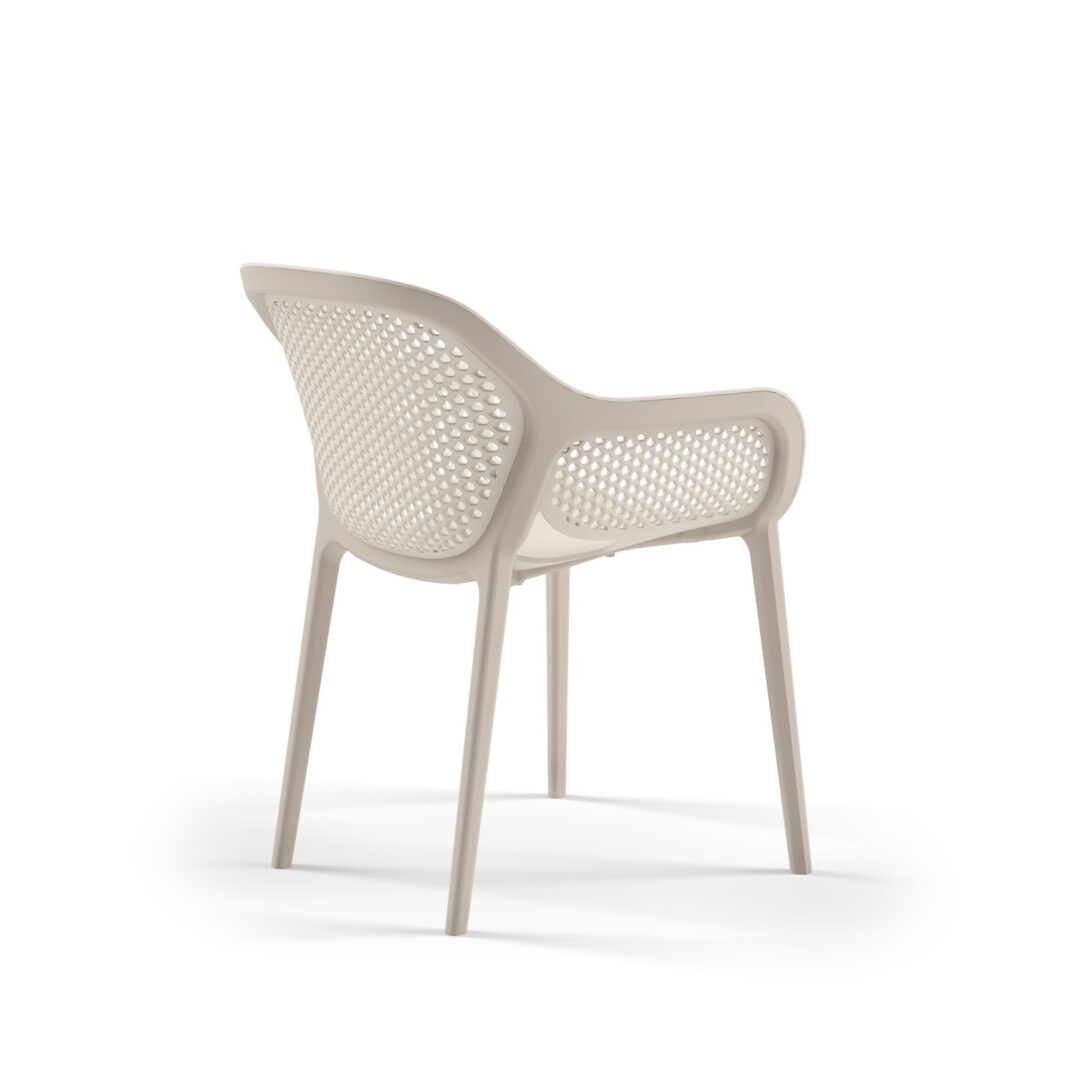 Gray Atra armchairs in a warm hotel lobby seating area, in-stock lounge furniture ready to ship from Keca's Florida showroom.