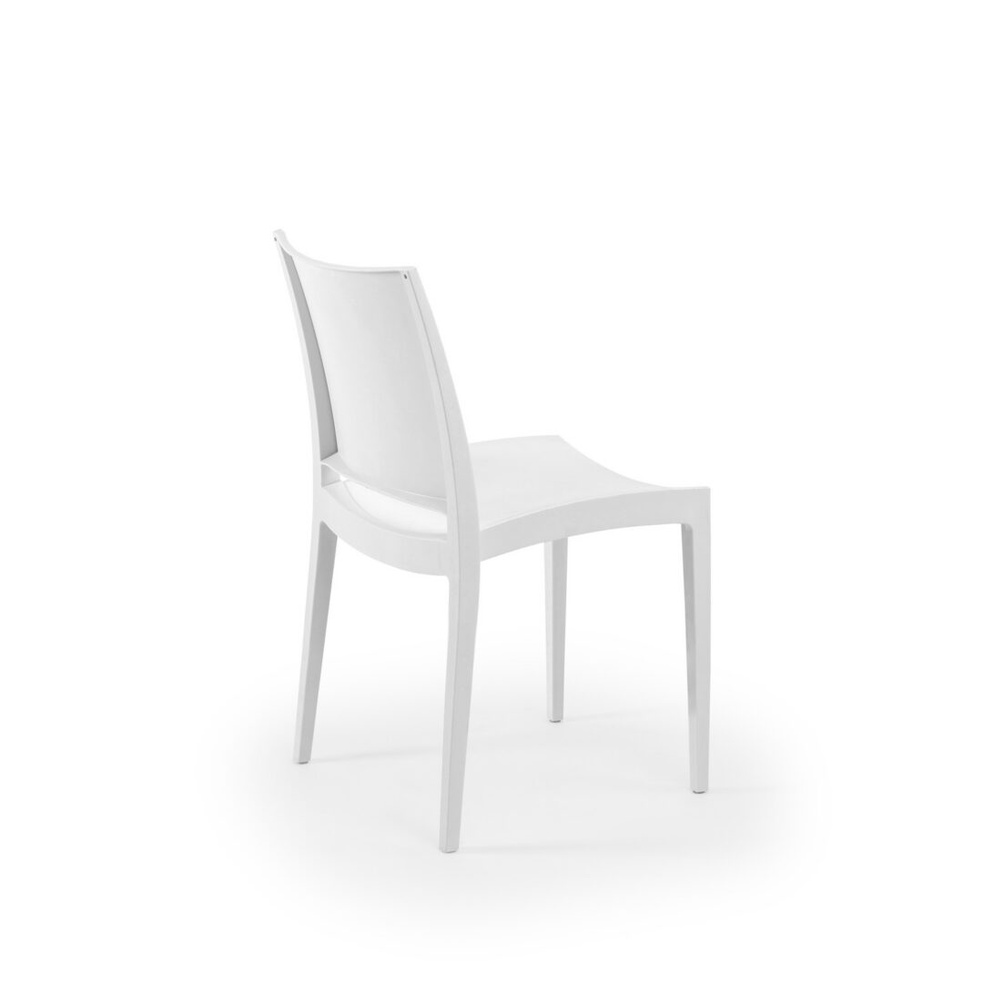 ivory Specto chairs at a contemporary restaurant dining table in warm natural light, in-stock commercial seating available now from Keca's Florida showroom.